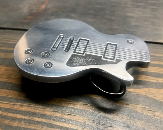 Guitar clearance belt buckles